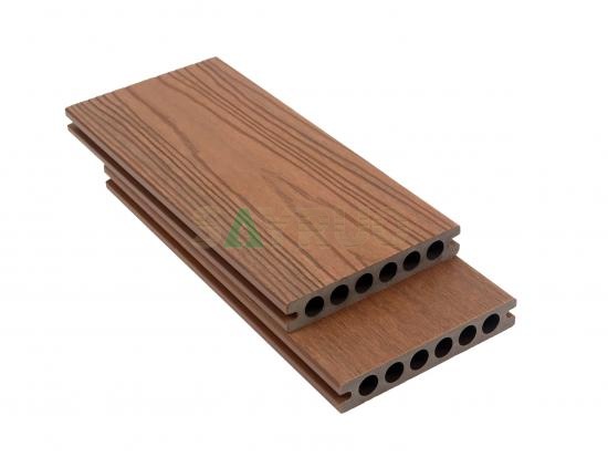 Co-extrusion embossed woodgrain composite decking
